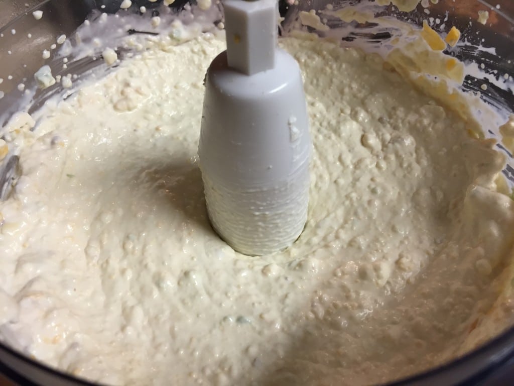 Mixing the cheese.