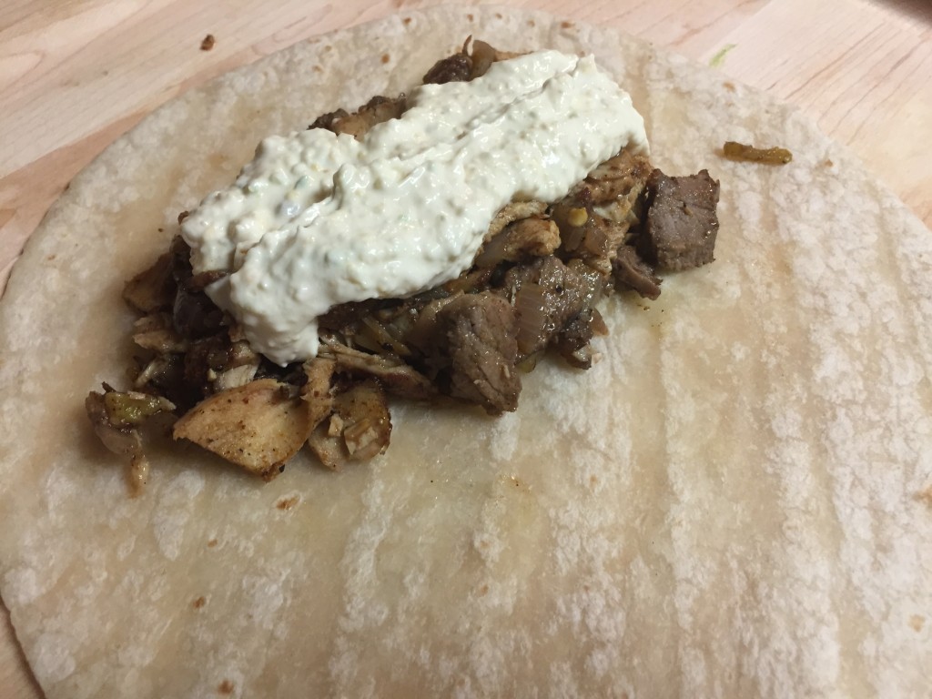 Add Fundido cheese on top of meat.