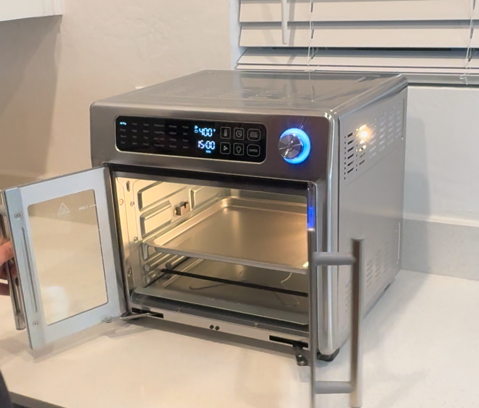 Interior view of Emeril Lagasse French door air fryer oven with rack and crumb tray
